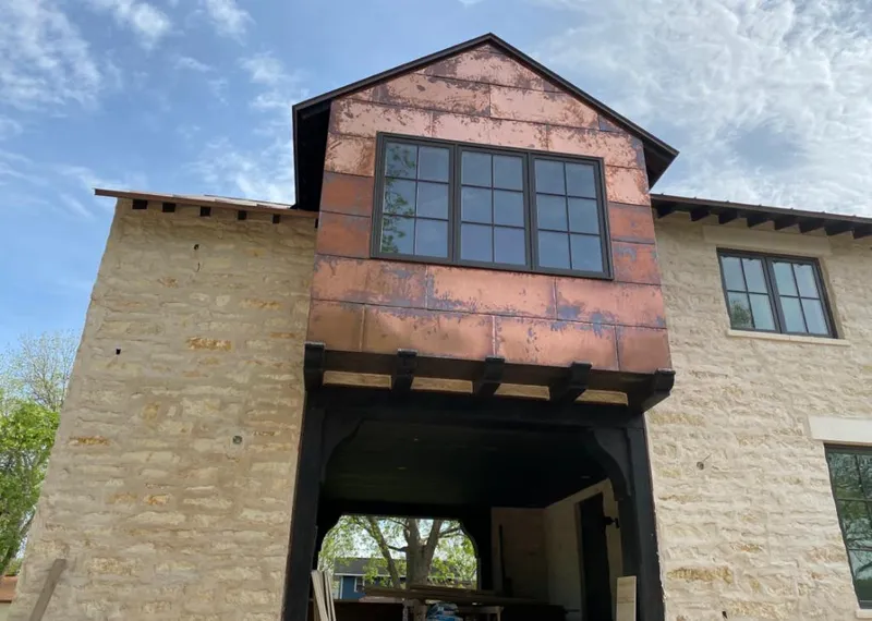 Copper metal panel facade on a stone building for Skylight Installation in Brecksville